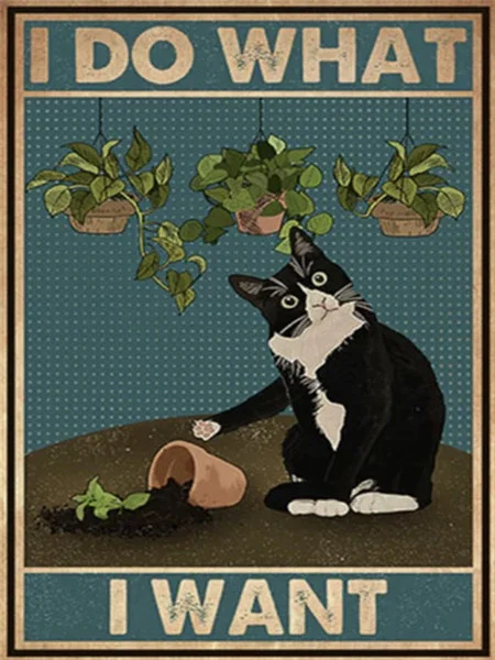 Tuxedo Cat Knocking Plant